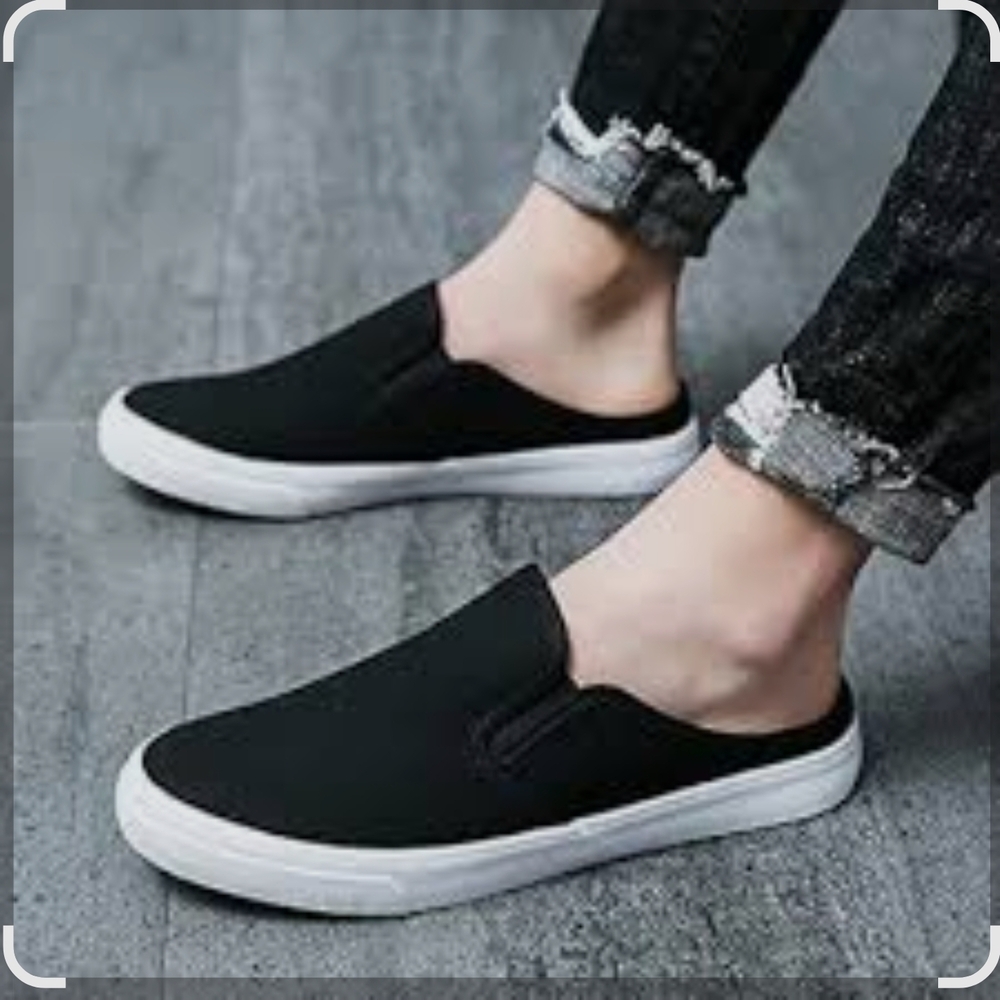 Sole Mate. Black and White Slip-On Loafers with Streamlined Design